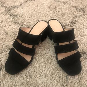 Black suede sandals.